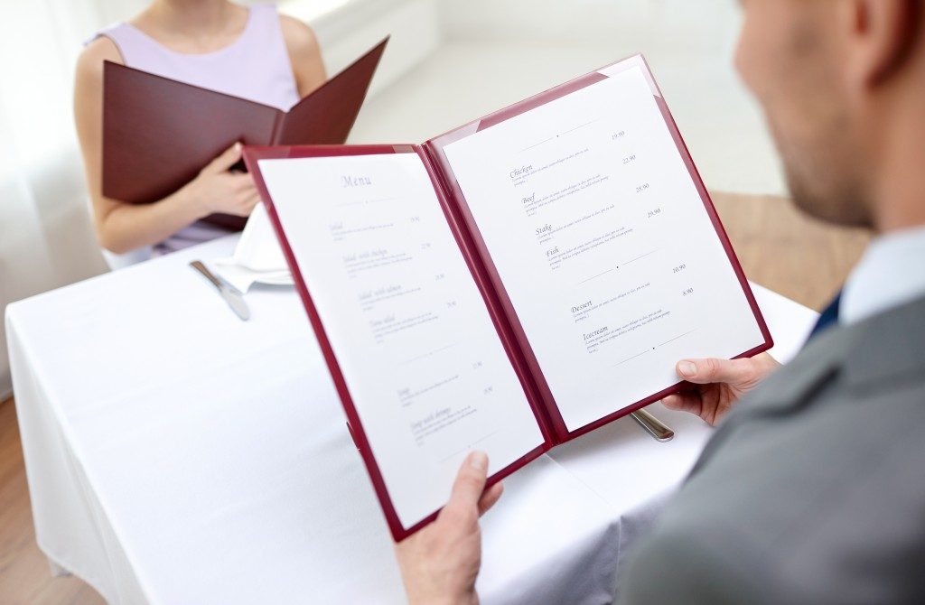 Couple looking at a menu